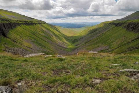 Dramatic view from High Cup Nick of chasm, Eden Valley, North Pennines, Cumbria Stock Photos