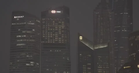 Dramatic View of HSBC and City Towers Illuminated at Nighttime Stock Footage 317344766