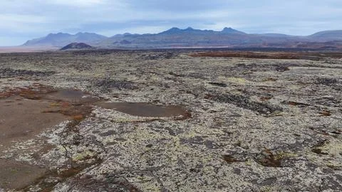 Dramatic view of Icelandic landscape - mountains and moss over lava rock Stock Photos