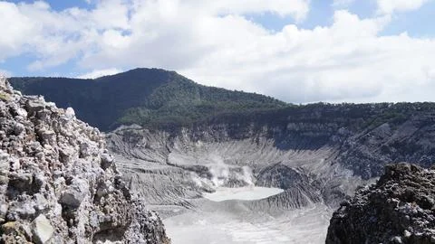 Dramatic View of Kawah Putih Volcano Crater Lake Stock Photos