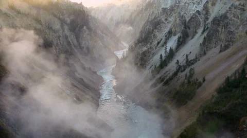 Dramatic view of Lower Falls waterfall in Yellowstone Stock Footage