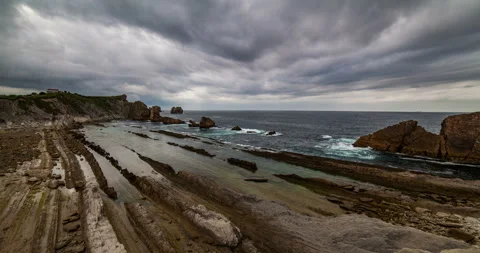 Dramatic view of Playa de la Arnia, Cantabria, Spain. Timelapse. Stock Footage 98659855