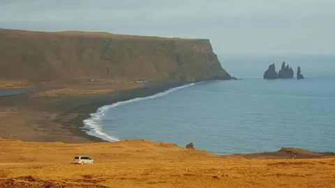 Dramatic View of Reynisdrangar Sea Stacks and Reynisfjara Black Sand Beach, Icel Stock Footage 320198941