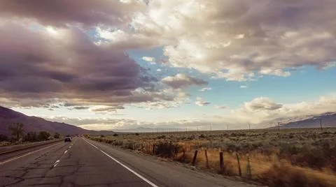 Dramatic view of road with cloudy and smokey sky from nearby fires Stock Photos