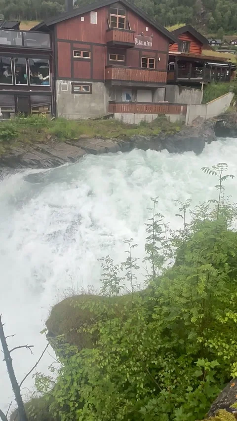 A dramatic view of rushing waters cascading near rugged mountains Stock Footage 316169271