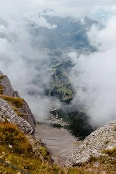 Dramatic view of Seceda mountains in Dolomites, Italy, shrouded in clouds Stock Photos