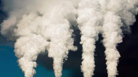 Dramatic view of smoke or steam columns from four red stacks on blue background. Stock Footage 38616338