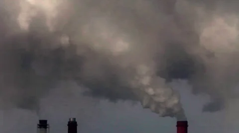Dramatic view of of three smoke or steam stacks with total smog above. Stock Footage 38614262