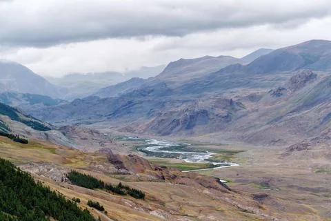 Dramatic view on wild altai mountains. In the background is the valley of t.. Stock Photos