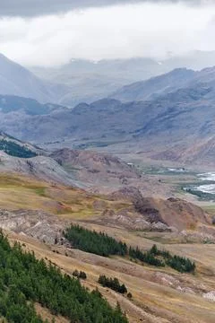 Dramatic view on wild altai mountains. In the background is the valley of t.. Stock Photos