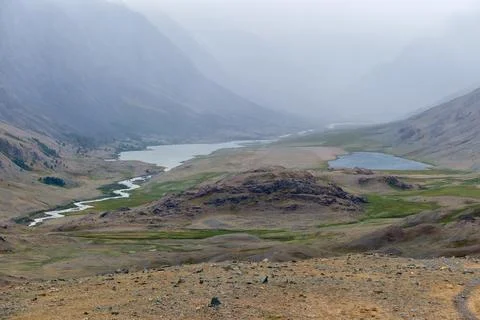 Dramatic view on wild altai mountains. In the background is Akkol river and.. Stock Photos