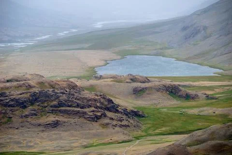 Dramatic view on wild altai mountains. In the background is Akkol river and.. Stock Photos