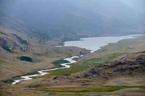 Dramatic view on wild altai mountains. In the background is Akkol river and.. Stock Photos