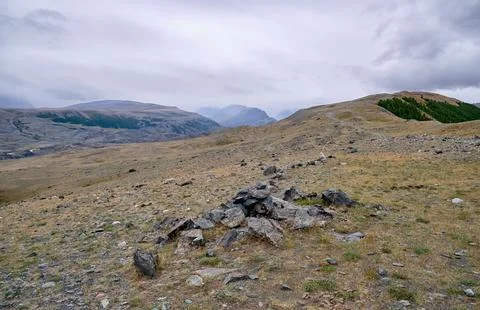 Dramatic view on wild altai mountains. In the background is the valley of t.. Stock Photos