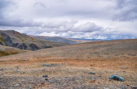 Dramatic view on wild altai mountains. In the background is the valley of t.. Stock Photos