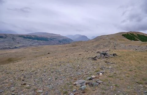 Dramatic view on wild altai mountains. In the background is the valley of t.. Stock Photos