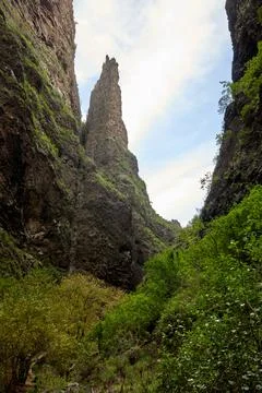 Dramatic Volcanic Canyon with Towering Rock Spire Stock Photos