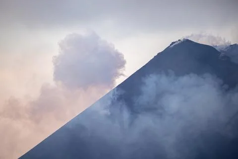 Dramatic Volcanic Cone Peak of Barren Island in Golden Hour Light Stock Photos