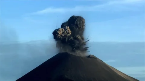 Dramatic Volcanic Eruption with Massive Ash Cloud in Daylight 4K Stock Footage 341563821