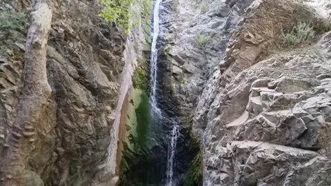 Dramatic waterfall in narrow Cyprus rocky gorge Stock Footage 328097980