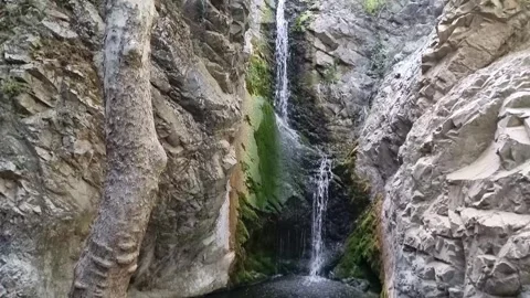 Dramatic waterfall in narrow Cyprus rocky gorge Stock Footage 328098008