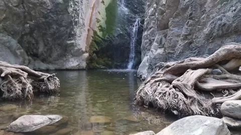 Dramatic waterfall in narrow Cyprus rocky gorge Stock Footage 328098035