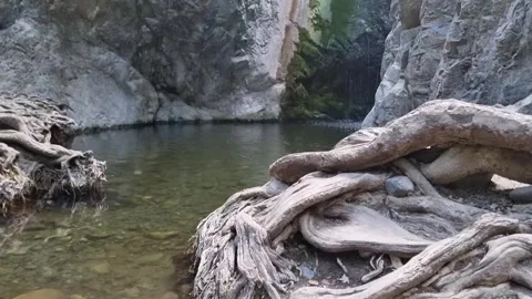 Dramatic waterfall in narrow Cyprus rocky gorge Stock Footage 328098036