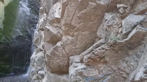 Dramatic waterfall in narrow Cyprus rocky gorge Stock Footage 328098080