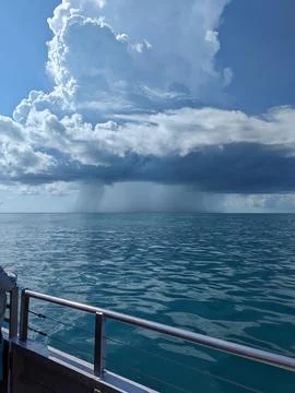 Dramatic Waterspout Under Stormy Clouds Over the Ocean with Intense Wind. Stock Photos