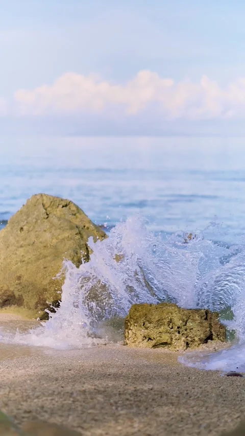 Dramatic Wave Splash on Coastal Rocks in Slow Motion. Slow Motion Water Imp.. Stock Footage 307696699