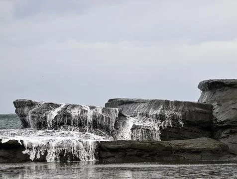 Dramatic Waves Crashing Over Rocks at Dolphin Point Stock Photos