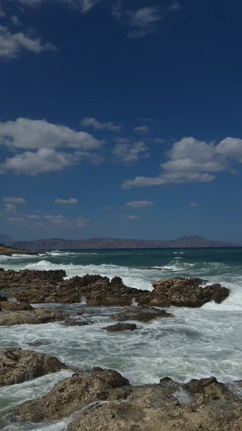 Dramatic Waves Crashing on Rocky Coastline 8K 30fps Video stock 317767147