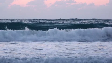 Dramatic waves reaching the shore in sunset with sound Stock Footage 66689418