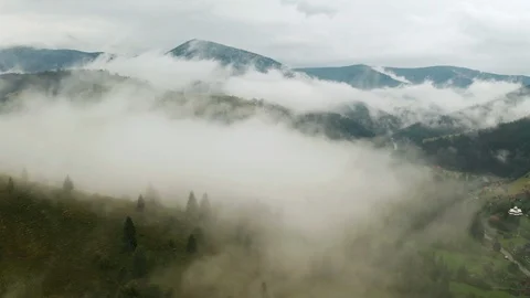 Dramatic weather in the mountains after rain. Fog in the mountains, aerial view Stock Footage 126035334
