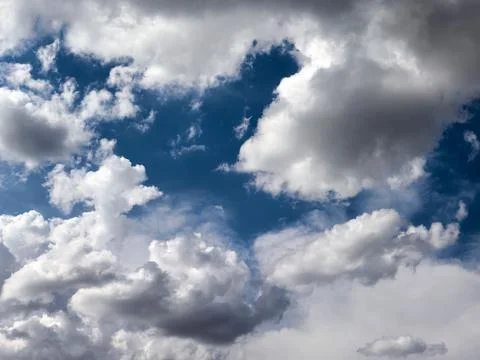 Dramatic White and Gray Cumulus Clouds in Blue Sky Stock Photos