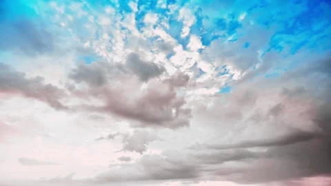 Dramatic white and grey clouds moving fast across a bright blue sky Stock Footage 332727214