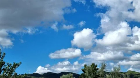 Dramatic White Clouds Across a Bright Blue Summer Sky Stock Photos