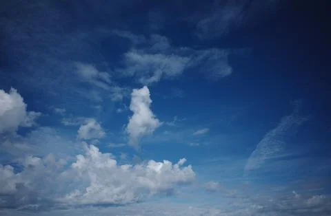 Dramatic White Clouds Across a Deep Blue Summer Sky Stock Photos