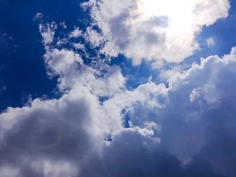 Dramatic White Clouds in Deep Blue Sky with Sunlight Stock Photos