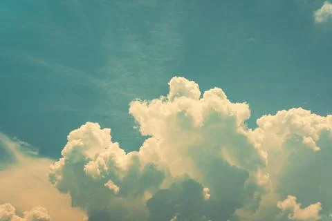 Dramatic White Cumulus Clouds Against Bright Blue Sky 스톡 사진