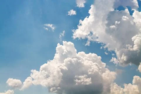 Dramatic White Cumulus Clouds Against a Bright Blue Summer Sky 写真素材
