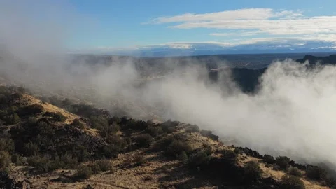 Dramatic White Mist Forming and Drifting Through a Deep Rocky Canyon Landscape 動画素材 333143621