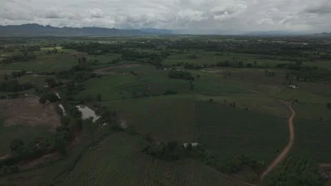 Dramatic Wide Aerial of Layered Green Hillsides and Rural Homesteads Under .. Stock Footage 337392904