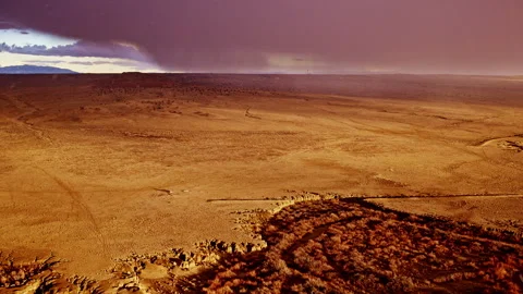 Dramatic wide drone shot of snow storm rolling in over new mexican plains Stock Footage 333415598
