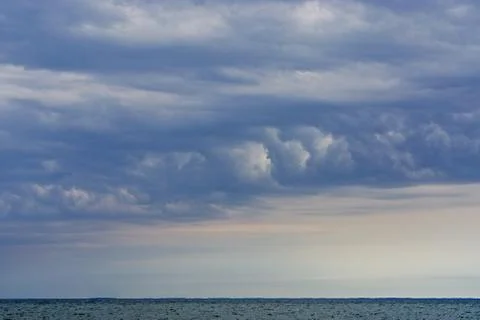 Dramatic, wind-swept clouds over the Chesapeake Bay. Stock Photos