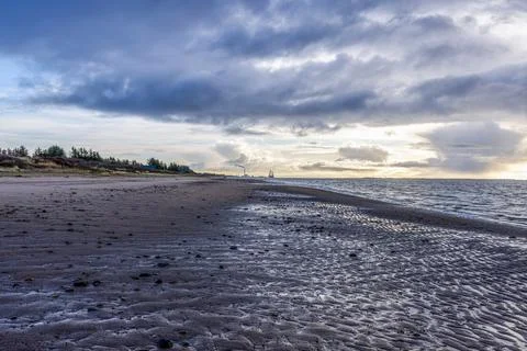 Dramatic winter clouds above Vejers Strand coastline Stock Photos