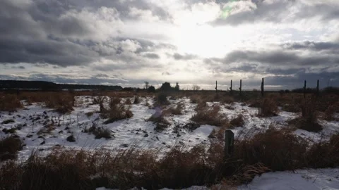 Dramatic Winter Sky Over Snow-Covered Field with Clouds Stock Footage 271201040