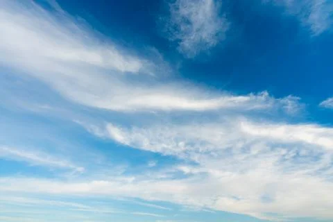 Dramatic Wispy Clouds in a Clear Blue Sky Over the Nile River. Stock Photos