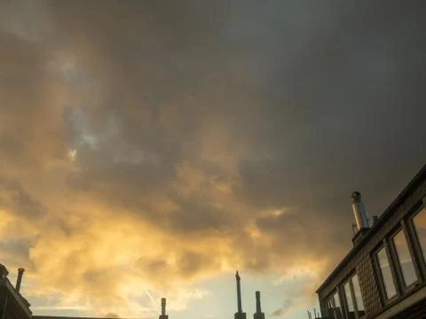 Dramatic yellow sky and dark clouds before a thunderstorm Stock Photos