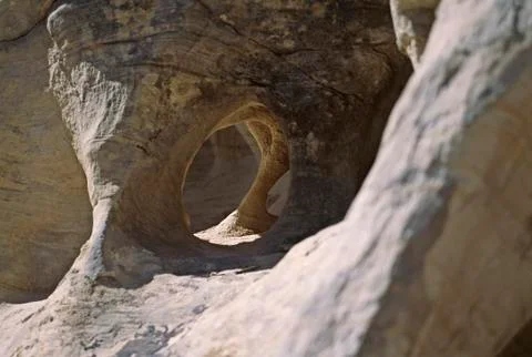 Dramatically eroded rock and strong lighting Stock Photos